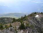 Looking back at the vehicles from the summit. You can just barely see the trucks in the centre left of the photo.