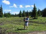 16. Kris pounding in the sign post Note damage to meadows in the back ground Whipsaw - July 2005. JPG0016