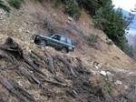 Climbing a steep slope to the first washout.