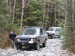 Convoy comes to a halt as someone ahead is stuck sideways across the trail.jpg