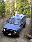Chris & his son in their Nissan Pathfinder.