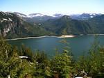Stave Lake and a distant tug pulling a small log boom.
