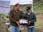 Dave presents Stuart's birthday cake on behalf of the Rover-Landers.