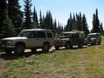 The trucks waiting as we picked up garbage and checked out the meadows.