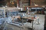 Parts being sorted and racked prior to dipping at Silver City.jpg