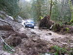 LR3 heads into the gooey mud slide ...