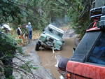 Plenty of help standing around to change that tire.