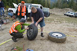 Kris Markson checks for correct tire pressure
