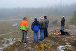 Teams & volunteers watching the course