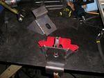 One motor mount jigged and tacked in preparation for welding and the other completed in the background. The "perfect" test measurement was 1 3/8" from the top of the frame, then to compensate for settling of the full floating rubber mounts, I subracted...