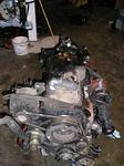 On an engine stand, drained and flipped upside down. Note angled oil pan to be removed.