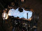 Scraping the old gasket with the internals protected.